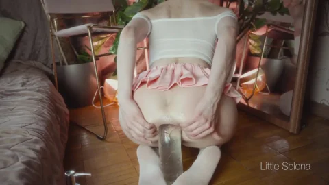 A beautiful girl stretches her ass with a huge toy