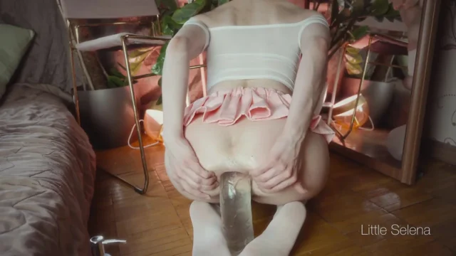 A beautiful girl stretches her ass with a huge toy