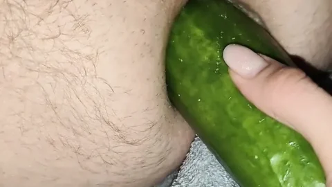 My wife is fucking my ass with a huge cucumber.